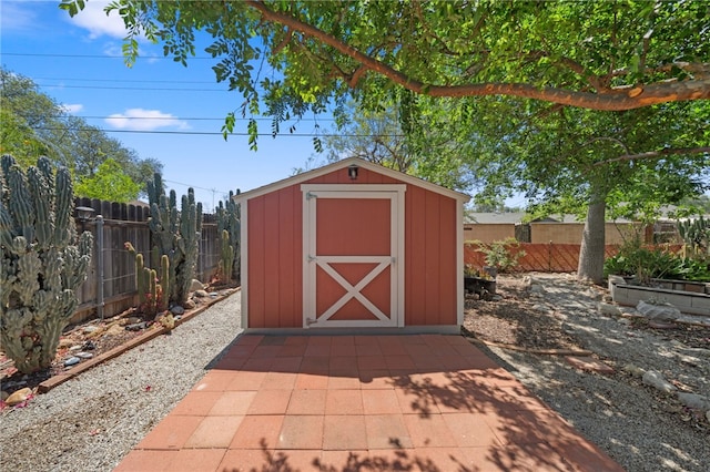 view of shed featuring a fenced backyard