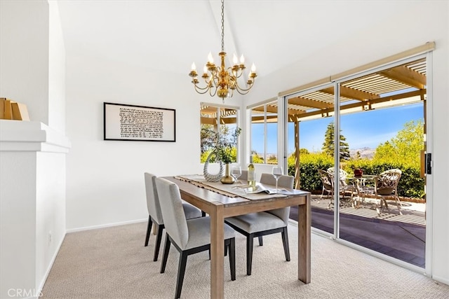 carpeted dining area with baseboards, lofted ceiling, and a notable chandelier