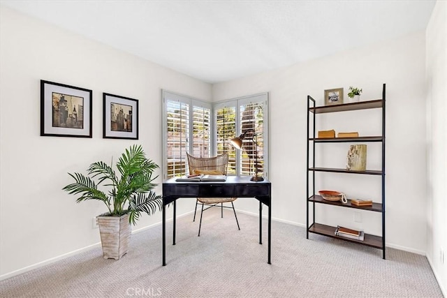 carpeted home office with baseboards
