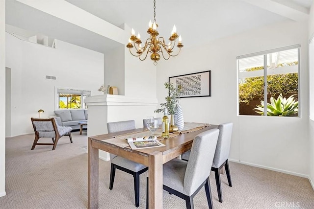 dining space with a notable chandelier, light colored carpet, baseboards, a towering ceiling, and visible vents