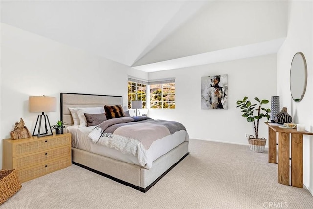 bedroom featuring baseboards, carpet, and lofted ceiling