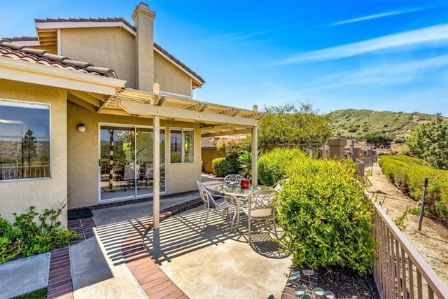 view of patio / terrace with outdoor dining area and fence