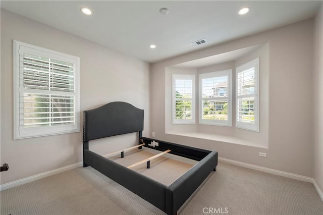 bedroom with baseboards, carpet flooring, recessed lighting, and visible vents