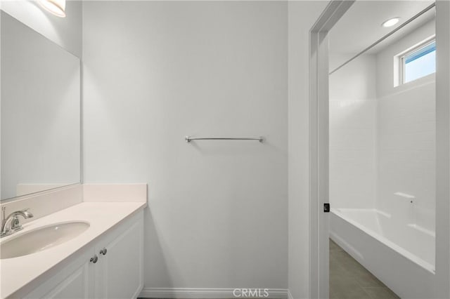 full bathroom featuring vanity, tile patterned flooring, baseboards, recessed lighting, and  shower combination