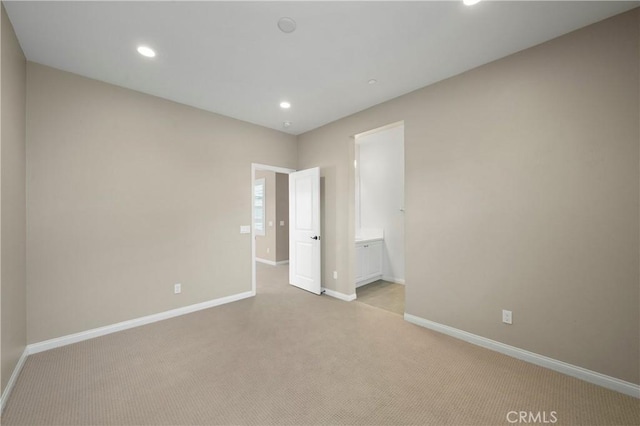 unfurnished bedroom featuring baseboards, carpet flooring, and recessed lighting