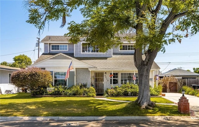 9712 Russell Ave, Garden Grove, CA 92844 - view of front facade featuring a front yard and fence