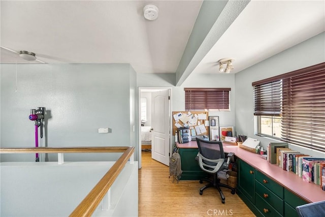 9712 Russell Ave, Garden Grove, CA 92844 - home office with light wood-style flooring and attic access