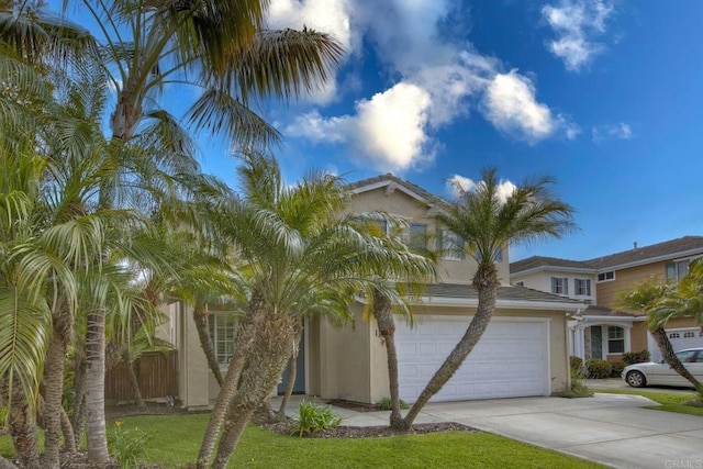 view of front of property with stucco siding and driveway