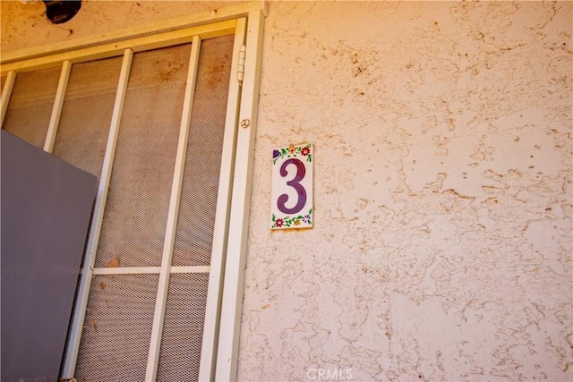 66365 5th St, Desert Hot Springs, CA 92240 - details featuring a heating unit and stucco siding