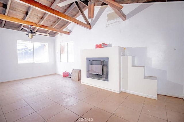 66365 5th St, Desert Hot Springs, CA 92240 - unfurnished living room with wood ceiling, beam ceiling, tile patterned flooring, and a fireplace