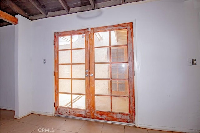 66365 5th St, Desert Hot Springs, CA 92240 - doorway to outside featuring baseboards, light tile patterned flooring, and french doors
