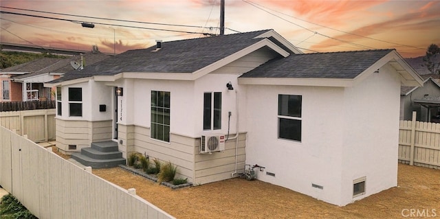 11714 S Spring St, Los Angeles, CA 90061 - exterior space with a fenced backyard, a shingled roof, ac unit, and crawl space