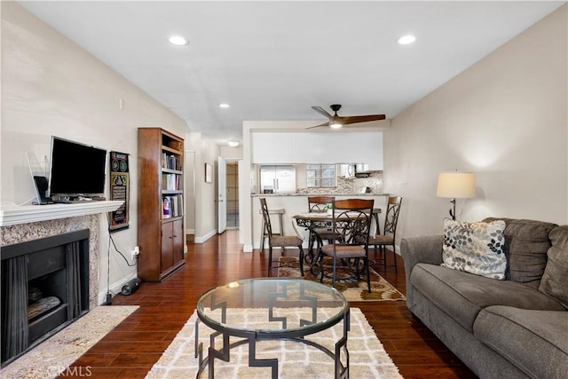 680 Grand Ave Unit 105, Long Beach, CA 90814 - living room with ceiling fan, baseboards, dark wood-style floors, recessed lighting, and a premium fireplace