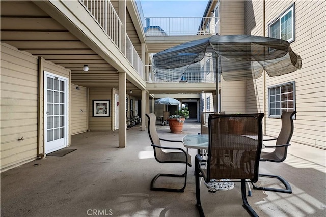 680 Grand Ave Unit 105, Long Beach, CA 90814 - view of patio / terrace with outdoor dining space and a balcony