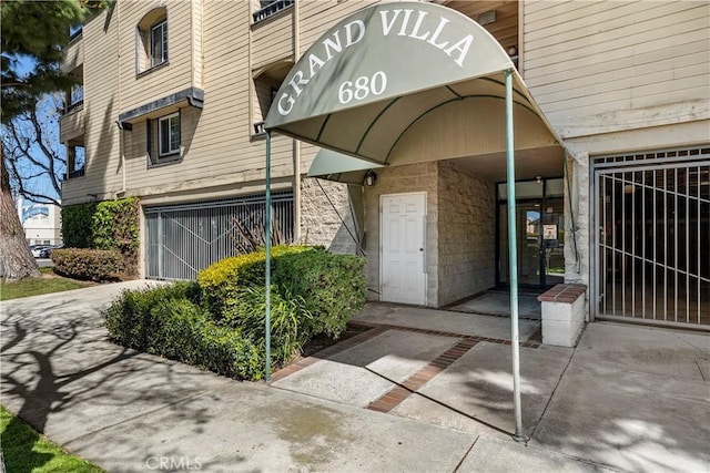 680 Grand Ave Unit 105, Long Beach, CA 90814 - property entrance featuring a garage and concrete driveway