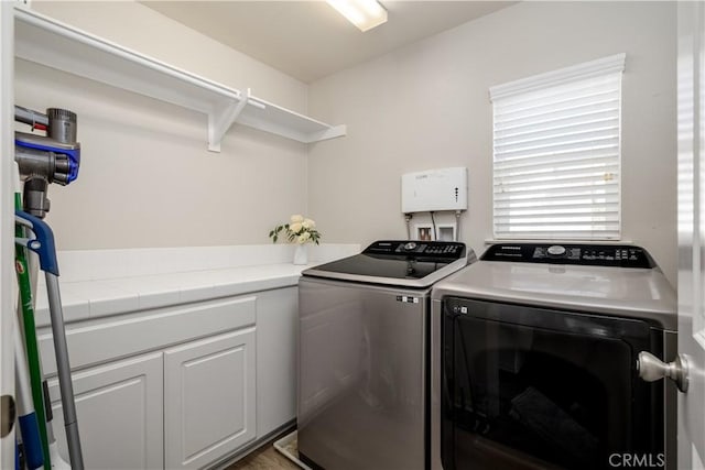 laundry area with laundry area and independent washer and dryer