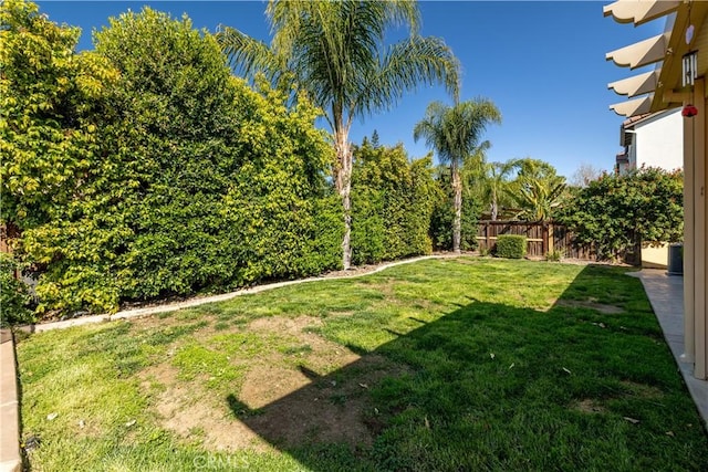 view of yard featuring fence