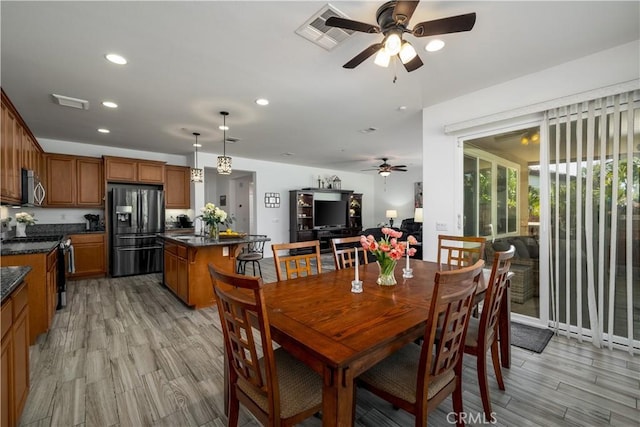 dining space with a ceiling fan, visible vents, recessed lighting, and light wood-type flooring