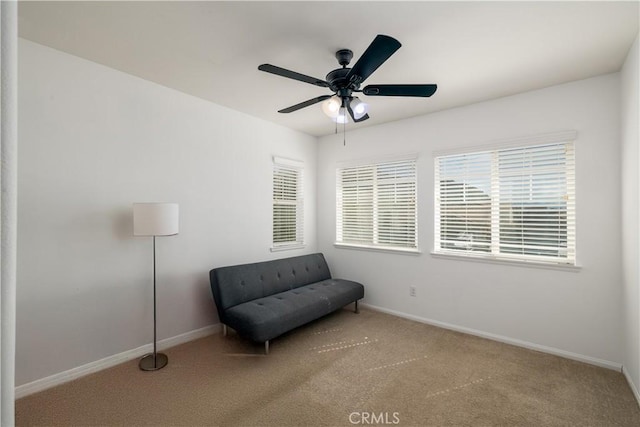 unfurnished room featuring a healthy amount of sunlight, baseboards, and carpet