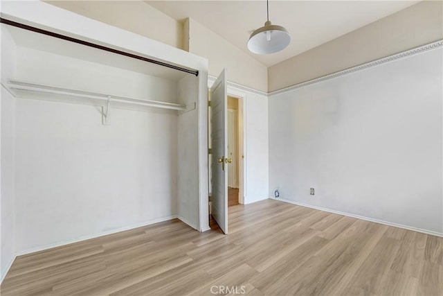 11300 Foothill Blvd Unit 97, Sylmar, CA 91342 - unfurnished bedroom featuring wood finished floors, baseboards, and a closet