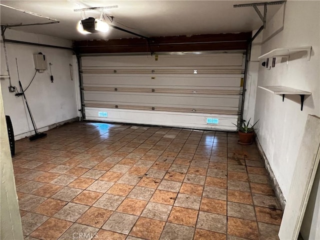 11300 Foothill Blvd Unit 97, Sylmar, CA 91342 - garage featuring a garage door opener and baseboards