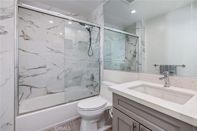 1055 S Serrano Ave Unit 502, Los Angeles, CA 90006 - full bathroom with vanity, recessed lighting, shower / bath combination with glass door, and toilet