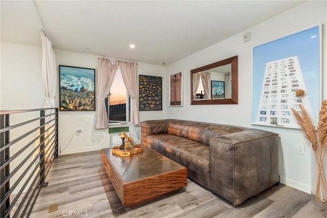 1055 S Serrano Ave Unit 502, Los Angeles, CA 90006 - living area with baseboards, recessed lighting, and wood finished floors