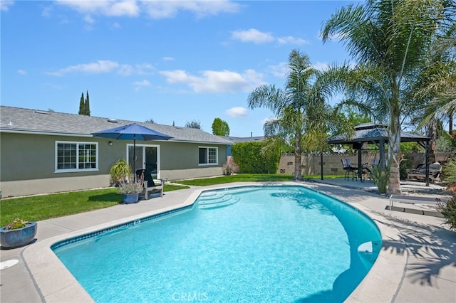 view of swimming pool with a gazebo, fence, a patio area, and a fenced in pool