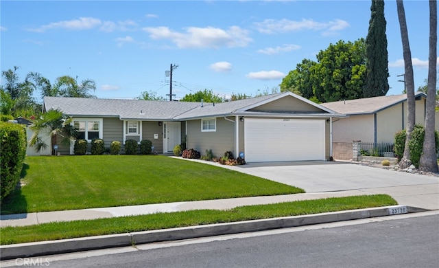 ranch-style house featuring concrete driveway, fence, a front yard, and a garage