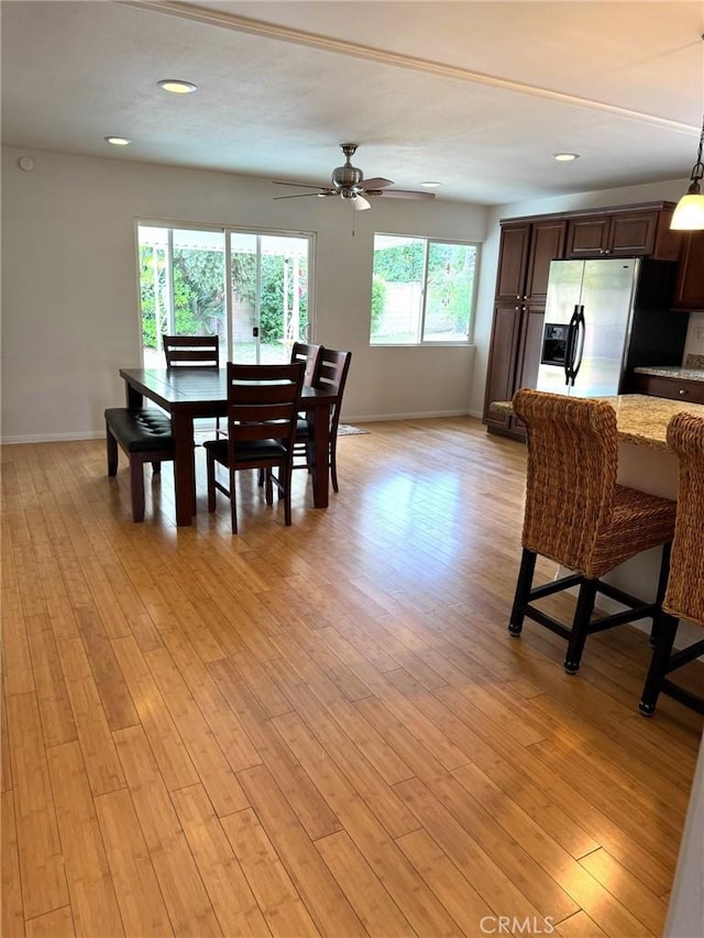 dining room with recessed lighting, baseboards, ceiling fan, and light wood finished floors