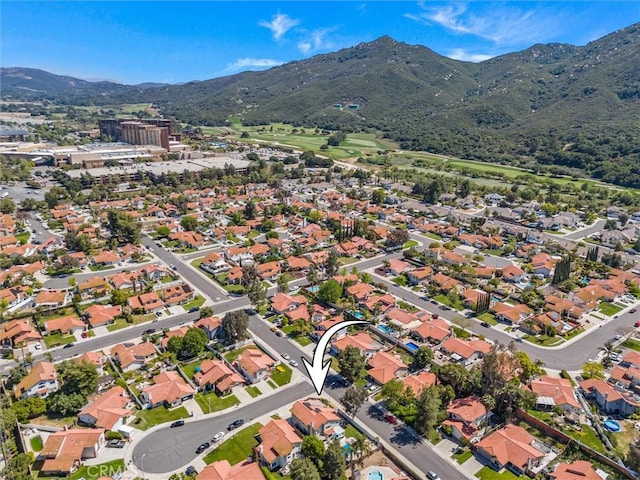 drone / aerial view with a mountain view and a residential view