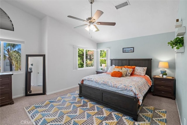 bedroom featuring light colored carpet, a ceiling fan, baseboards, vaulted ceiling, and visible vents