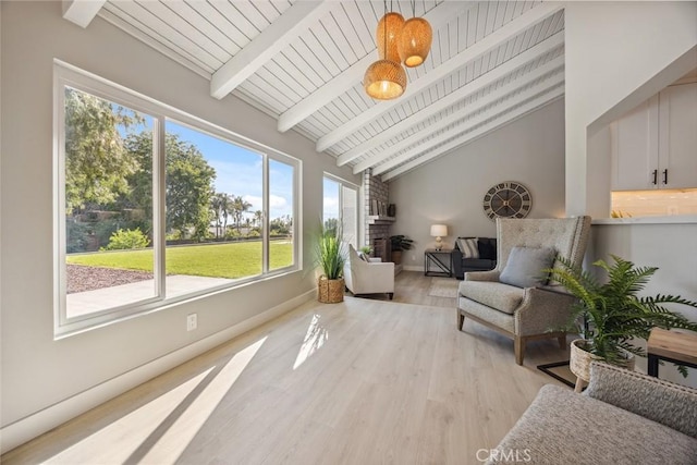18128 Cari Ln, Yorba Linda, CA 92886 - living area featuring baseboards, lofted ceiling with beams, light wood finished floors, and a fireplace
