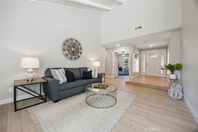 18128 Cari Ln, Yorba Linda, CA 92886 - living room with visible vents, wood finished floors, baseboards, high vaulted ceiling, and beamed ceiling