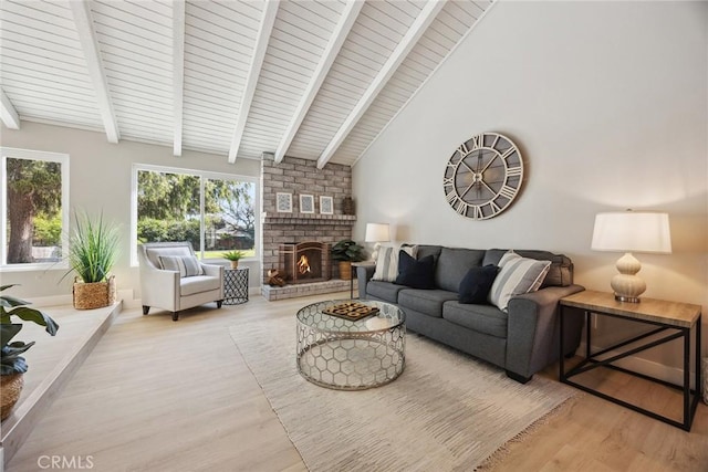 18128 Cari Ln, Yorba Linda, CA 92886 - living room with lofted ceiling with beams, wood ceiling, a brick fireplace, and wood finished floors
