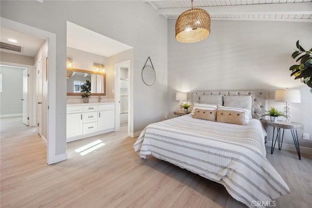 18128 Cari Ln, Yorba Linda, CA 92886 - bedroom with visible vents, baseboards, high vaulted ceiling, connected bathroom, and light wood finished floors