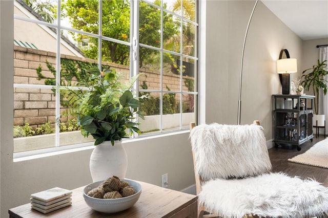interior space featuring wood finished floors and baseboards