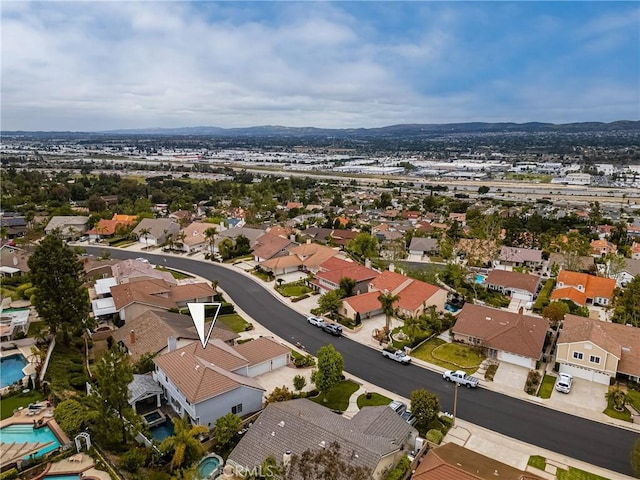 aerial view featuring a mountain view and a residential view