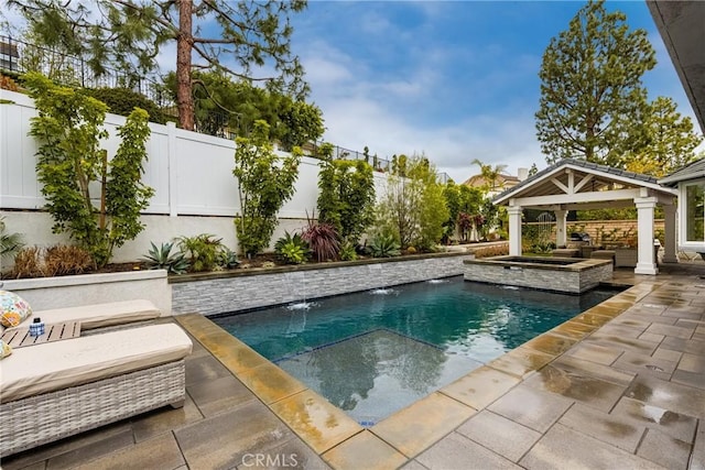 outdoor pool with a patio area, a gazebo, and a fenced backyard