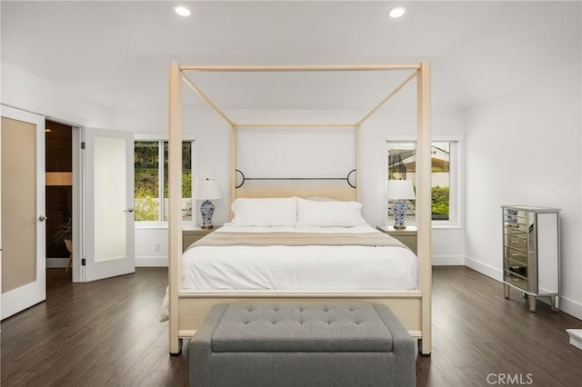 bedroom with multiple windows, wood finished floors, and recessed lighting