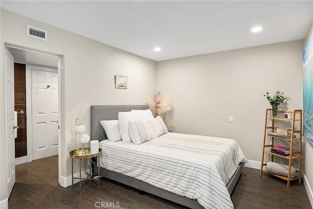 bedroom with recessed lighting, baseboards, visible vents, and wood finished floors