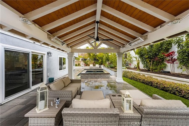 view of patio / terrace featuring an outdoor hangout area, an in ground hot tub, a gazebo, and ceiling fan