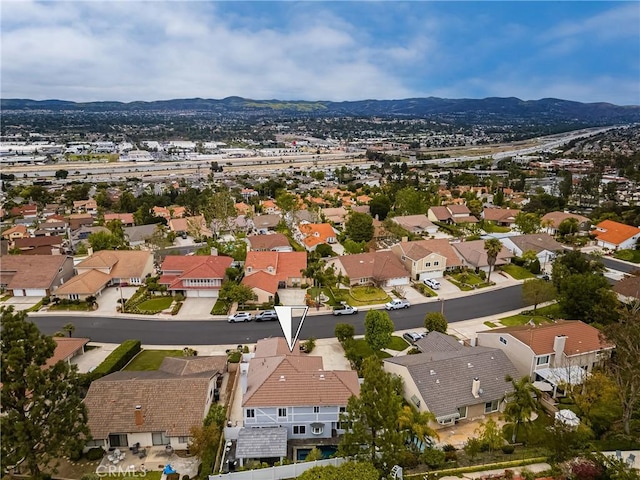 drone / aerial view with a mountain view and a residential view