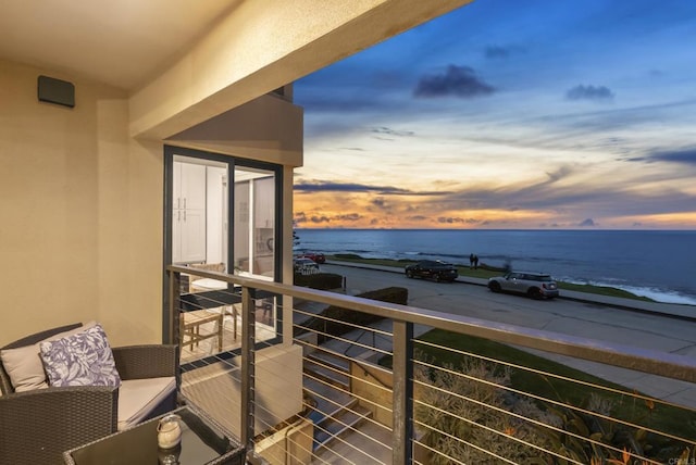 balcony at dusk with a water view