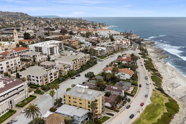 bird's eye view featuring a water view and a view of the beach