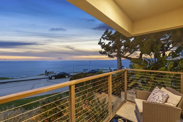balcony at dusk with a water view