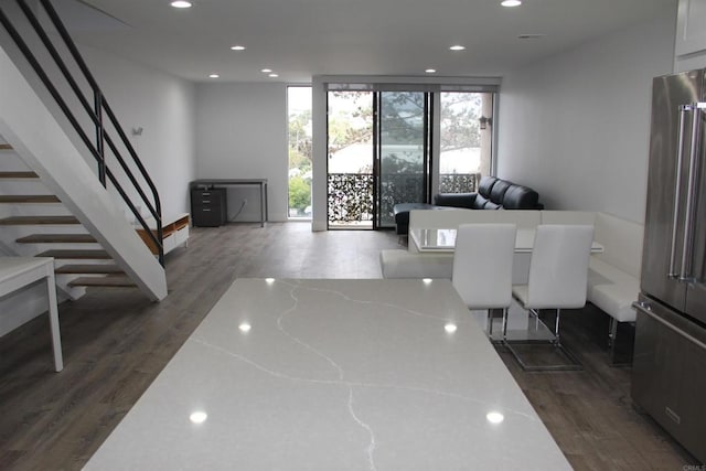 922 Sealane Dr Unit B, Encinitas, CA 92024 - dining room with dark wood-style flooring, recessed lighting, a wall of windows, and stairway