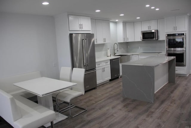 922 Sealane Dr Unit B, Encinitas, CA 92024 - kitchen featuring black appliances, recessed lighting, decorative backsplash, white cabinets, and dark wood-style flooring
