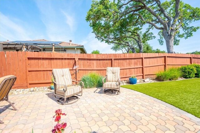 view of patio / terrace featuring fence