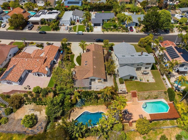birds eye view of property with a residential view